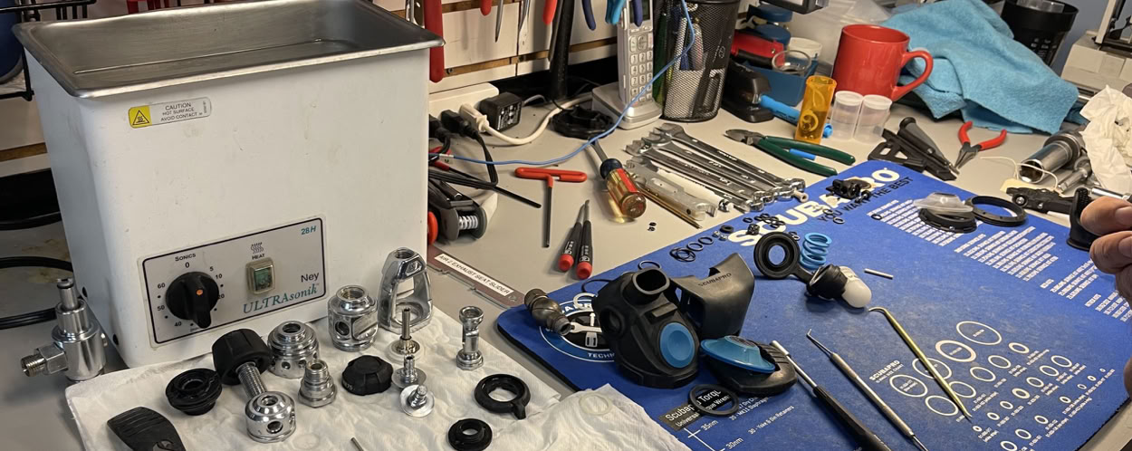 A brave firefighter in protective gear sprays water during training or emergency.